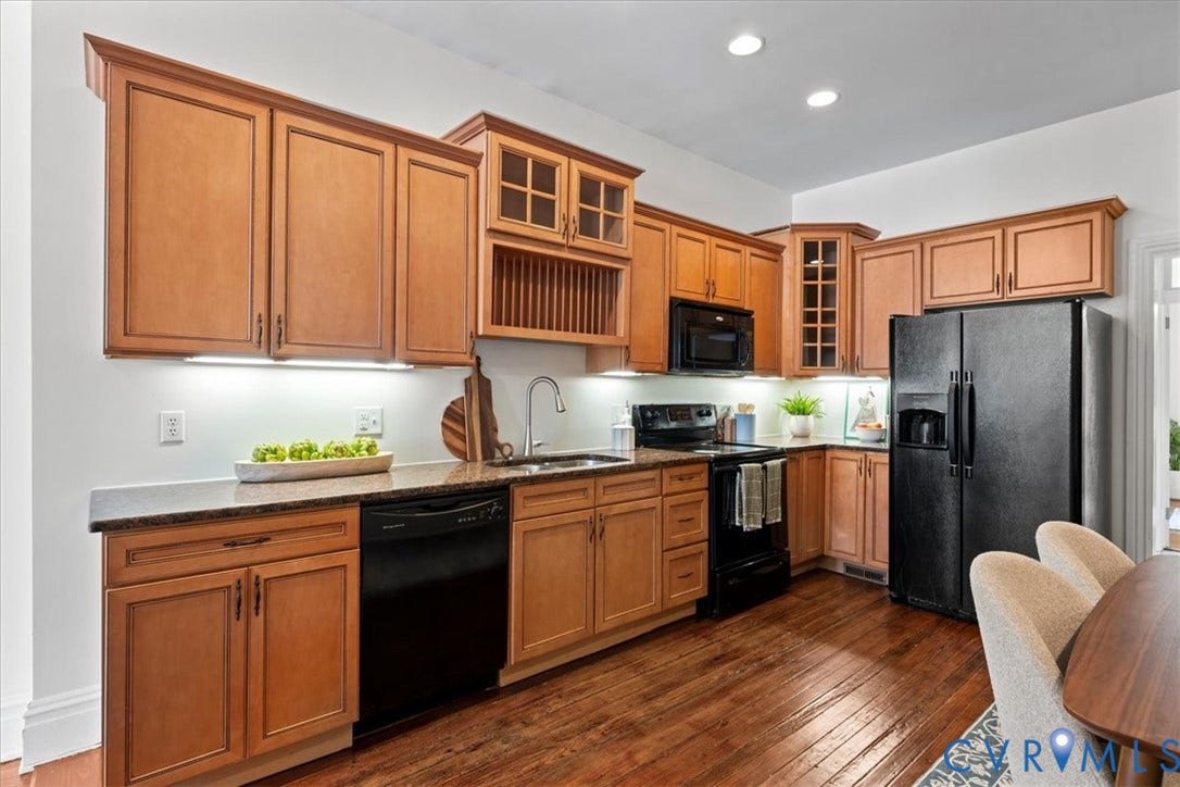2510 E Leigh Street, Church Hill, Richmond, VA 23223 Kitchen featuring wood-finish cabinetry, black appliances, granite countertops, and wood-finish flooring