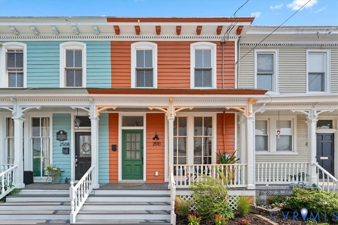 2510 E Leigh Street, Church Hill, Richmond, VA 23223 Ornate porch with white balustrade, decorative corbels, and a green front door