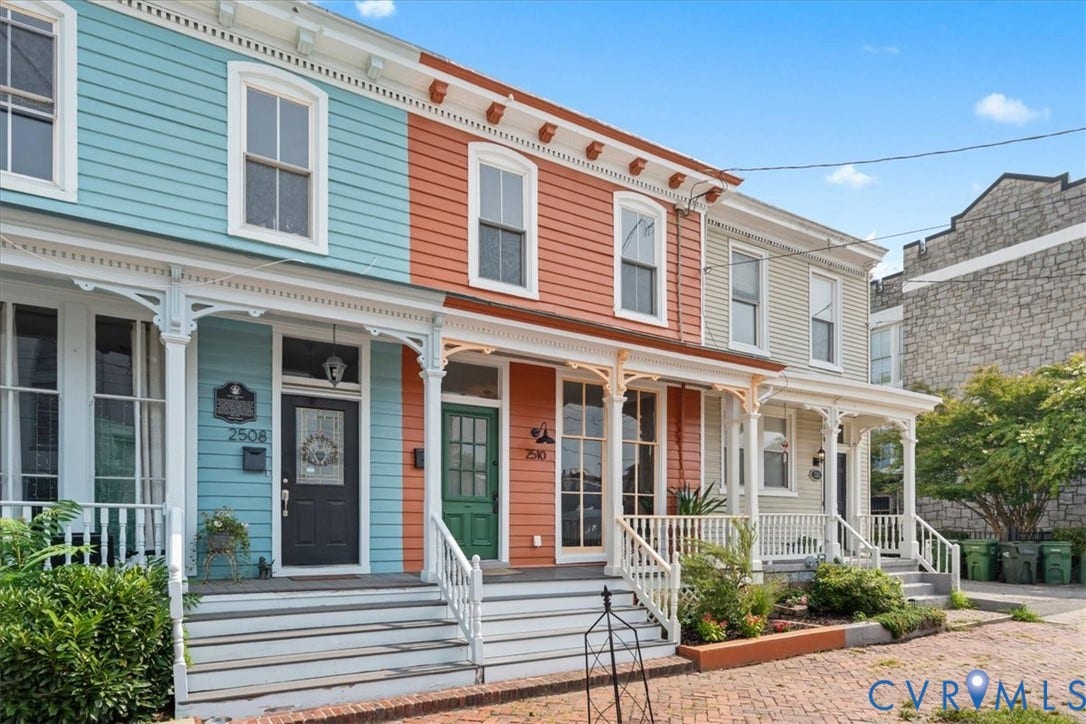 2510 E Leigh Street, Church Hill, Richmond, VA 23223 Architectural features include decorative porch columns, white window trim, and horizontal siding