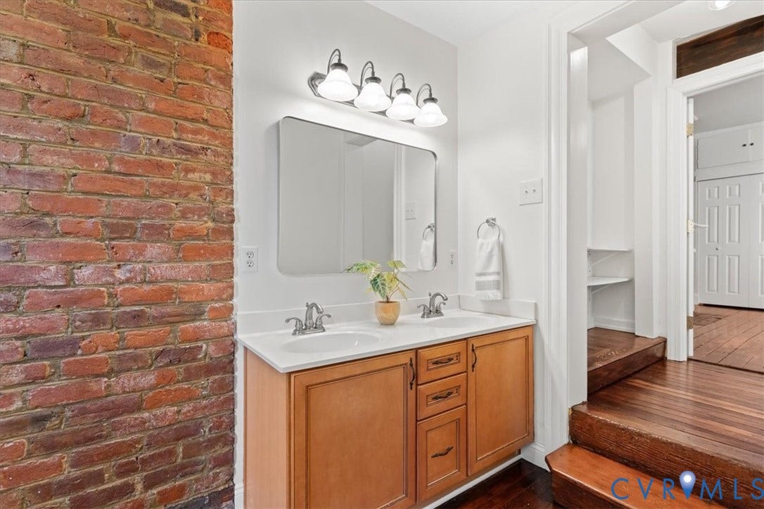 2510 E Leigh Street, Church Hill, Richmond, VA 23223 Dual vanity with built-in cabinetry and white countertop