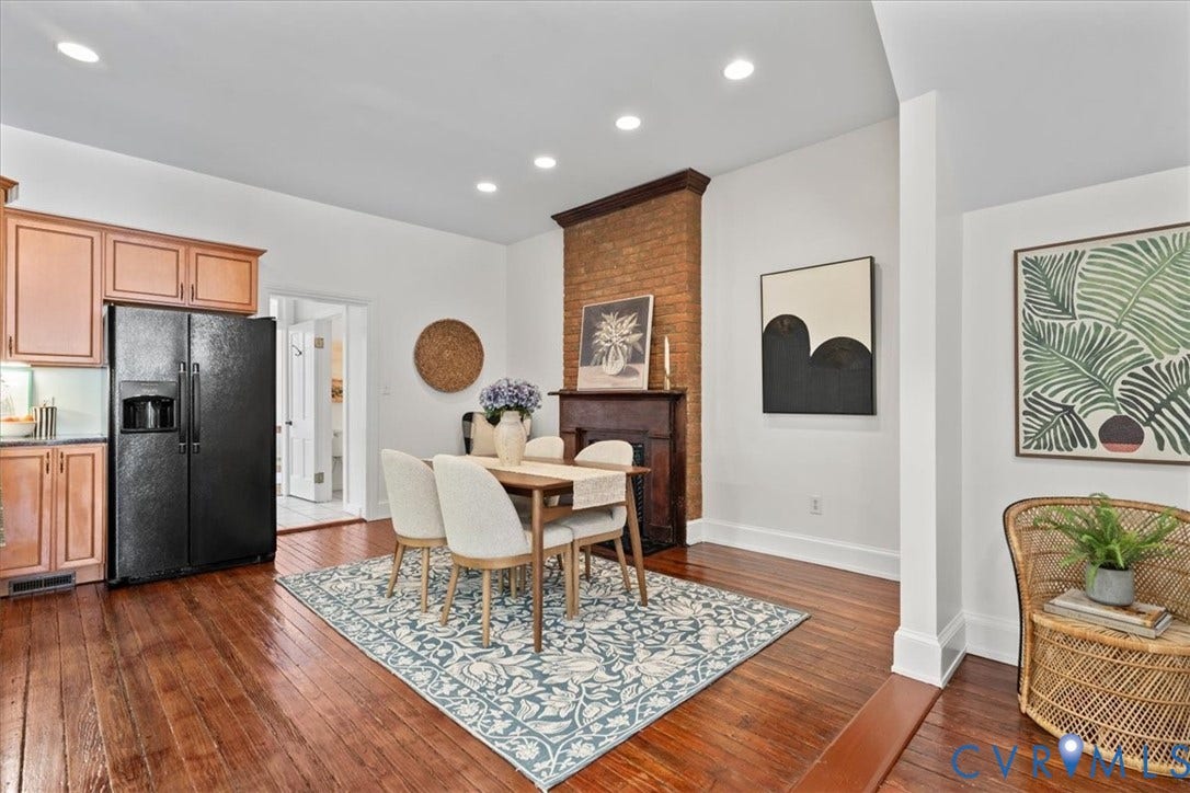 2510 E Leigh Street, Church Hill, Richmond, VA 23223 Hardwood flooring throughout, recessed lighting, exposed brick accent wall, and a built-in kitchen refrigerator