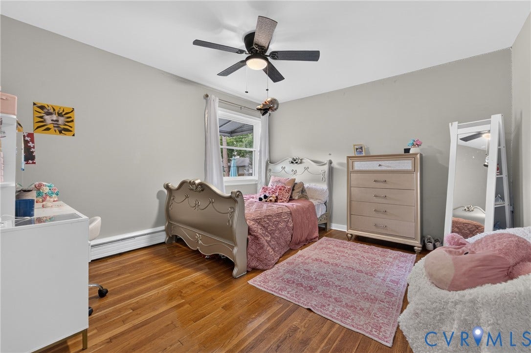 3401 Austin Avenue, Brentwood, Henrico, VA 23222 Spacious room featuring wood-finish flooring, a ceiling fan with integrated lighting, and a window with white trim