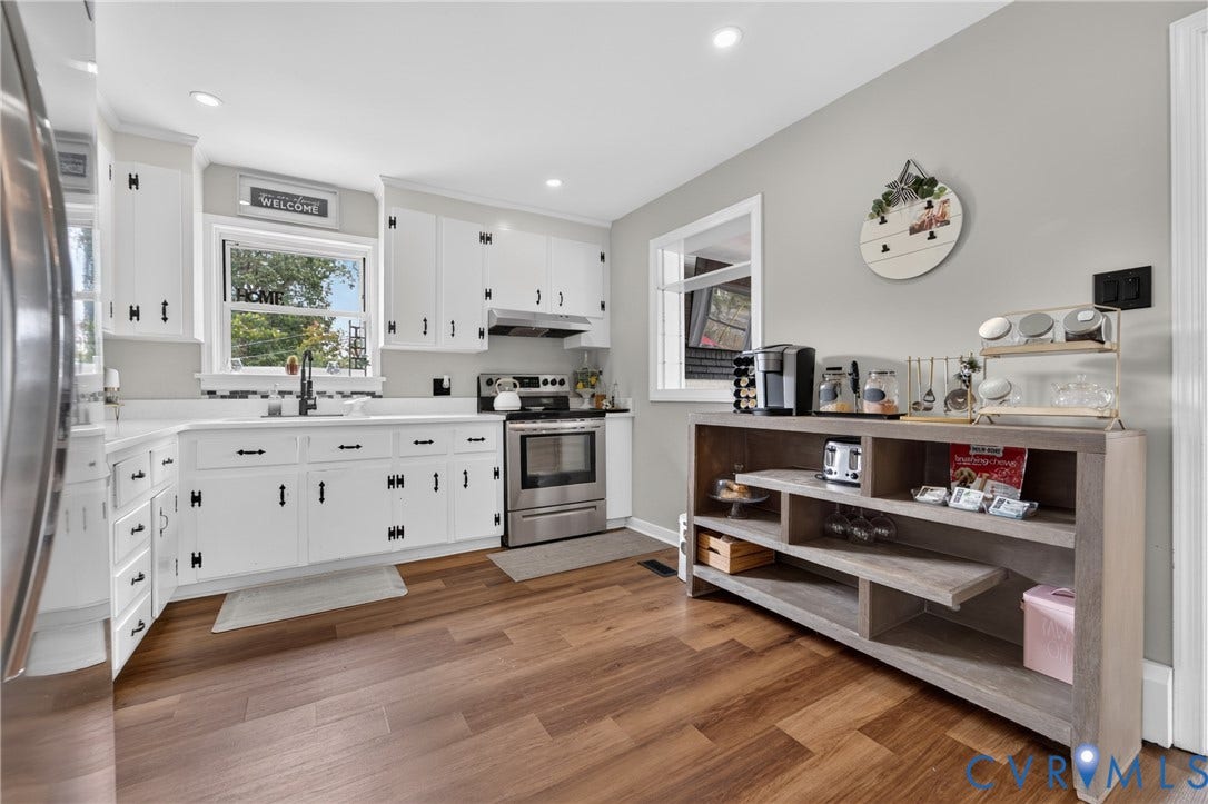 3401 Austin Avenue, Brentwood, Henrico, VA 23222 Kitchen featuring wood-finish flooring, white cabinetry with black hardware, stainless steel appliances, and recessed lighting