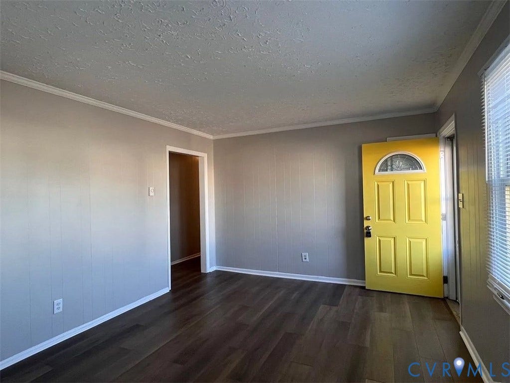 20507 Hickory Court, South Chesterfield, VA 23803 Entryway featuring a bright yellow paneled door with an arched decorative glass insert
