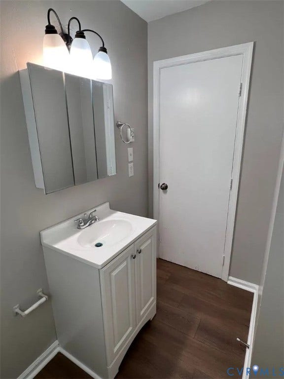 20507 Hickory Court, South Chesterfield, VA 23803 Bathroom vanity featuring a white cabinet with dual doors and a white countertop with an integrated sink