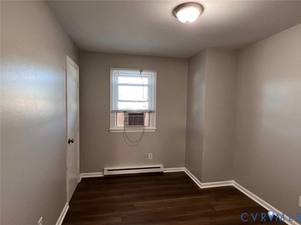 20507 Hickory Court, South Chesterfield, VA 23803 Room featuring wood-finish flooring, neutral wall paint, and white baseboards