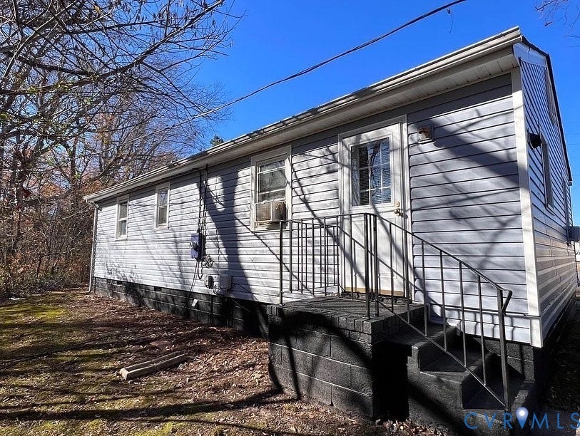 20507 Hickory Court, South Chesterfield, VA 23803 Light blue siding exterior with white trim and a gabled roofline