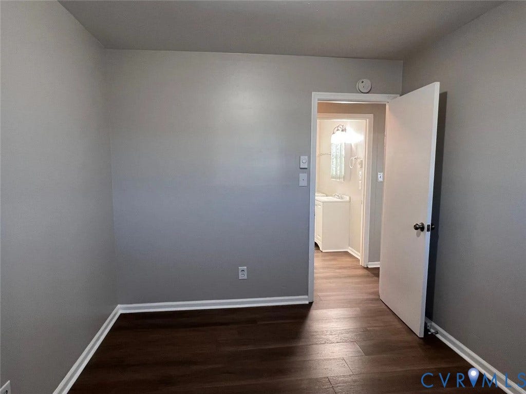 20507 Hickory Court, South Chesterfield, VA 23803 Room featuring wood-finish flooring, light gray walls, and white baseboards