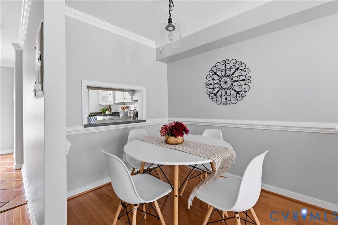 405 N Hamilton Street, #G, Richmond, VA 23221 Hardwood flooring, crown molding, chair rail molding, pass-through window, and a ceiling-mounted light fixture