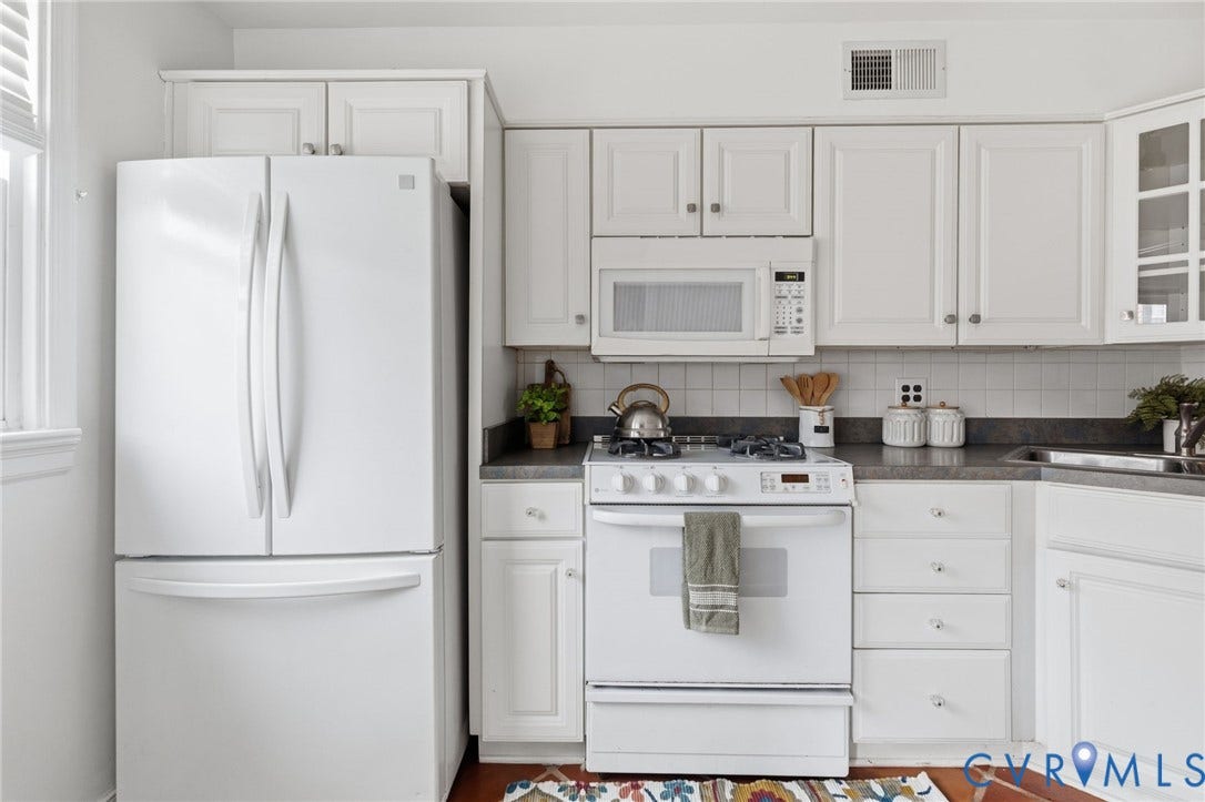 405 N Hamilton Street, #G, Richmond, VA 23221 White cabinetry with silver-tone hardware, white over-the-range microwave, white gas range, and a white French door refrigerator