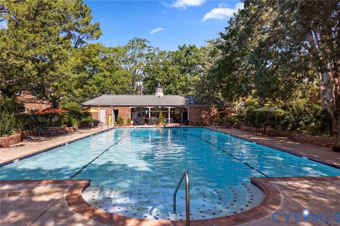 405 N Hamilton Street, #G, Richmond, VA 23221 Rectangular inground pool with integrated steps, concrete surround, and brick privacy walls