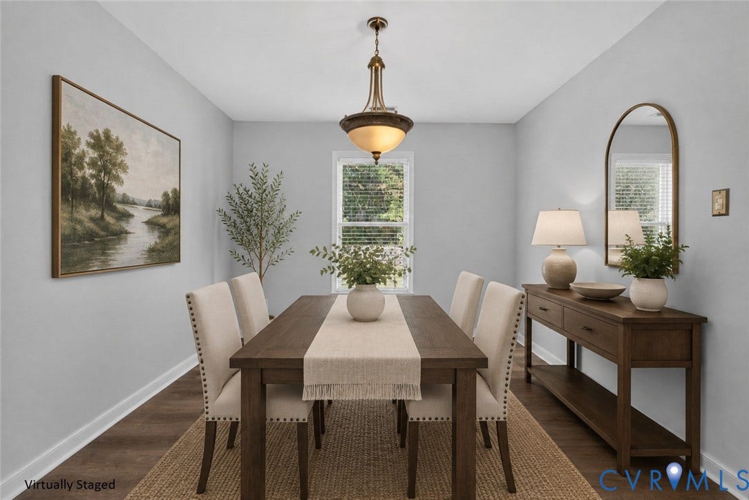 2020 Knotty Drive, Glen Allen, VA 23060 Elegant formal dining room showcasing a wood-finish table, upholstered dining chairs with nailhead trim, and wide-plank wood-finish flooring