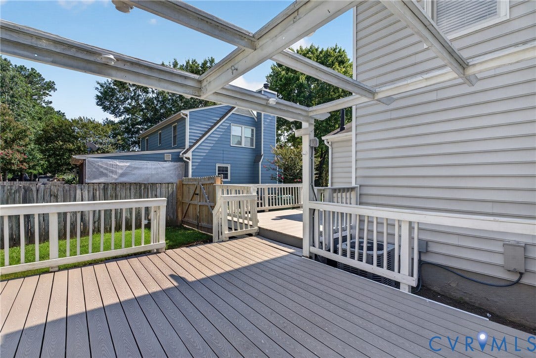 2020 Knotty Drive, Glen Allen, VA 23060 Expansive outdoor deck with composite decking and white railing, featuring a partial pergola