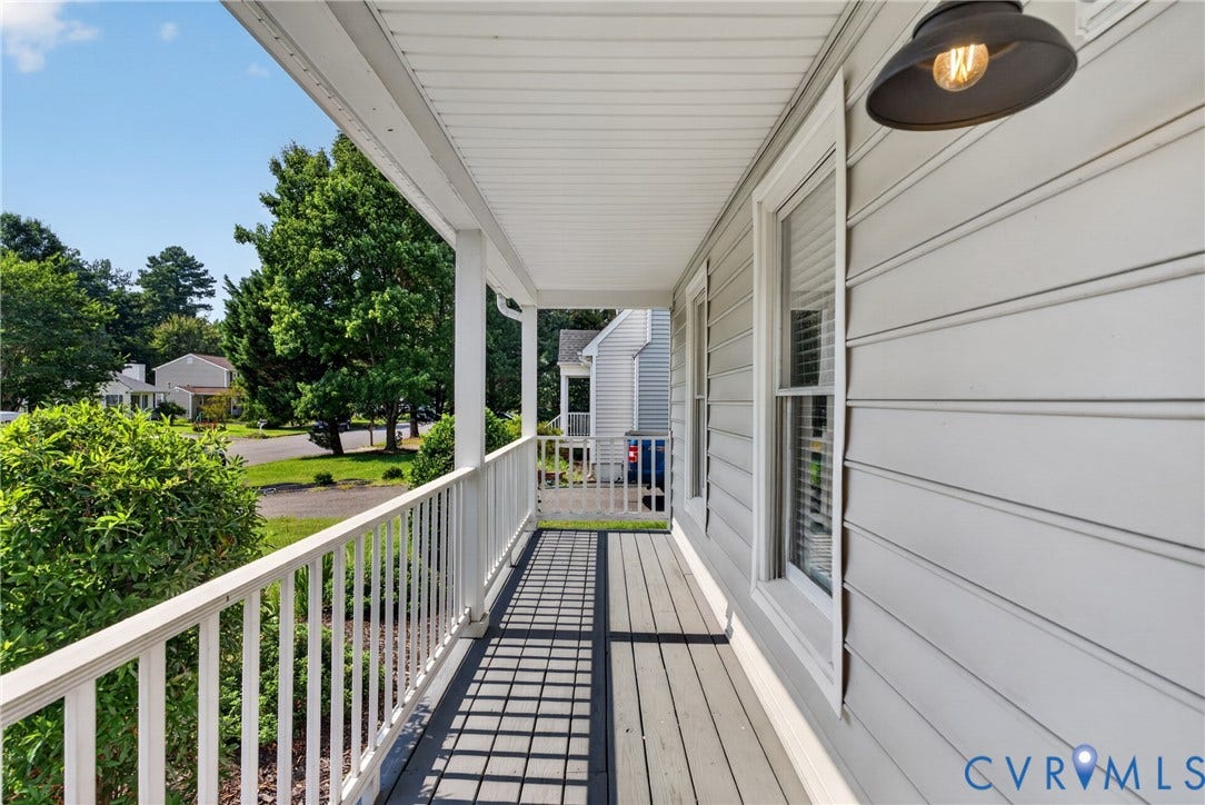 2020 Knotty Drive, Glen Allen, VA 23060 Covered deck with composite decking and white aluminum railings, featuring recessed lighting and direct access to the home's exterior