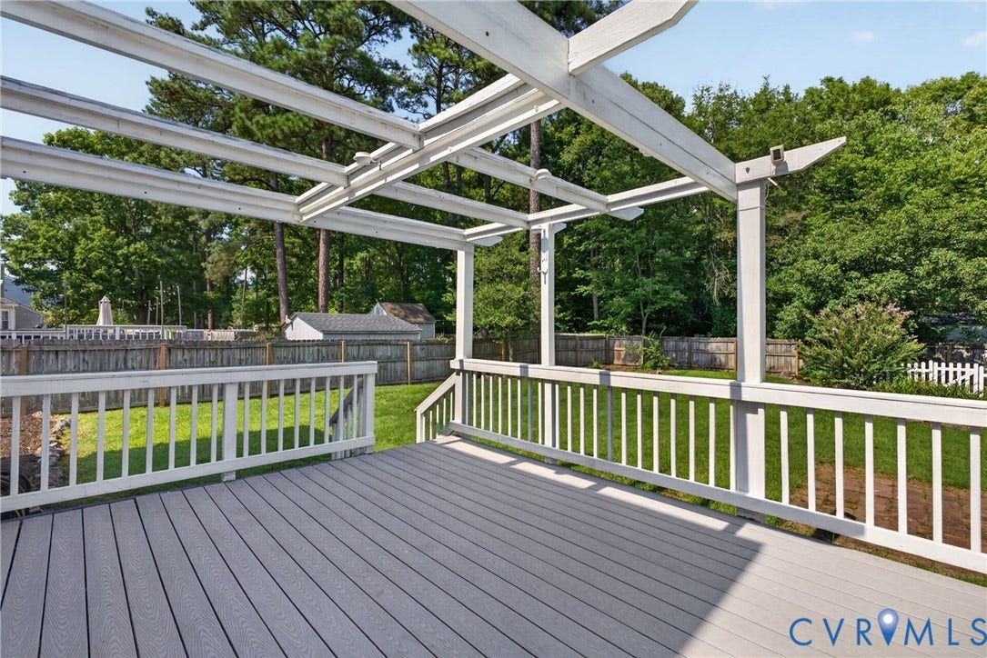 2020 Knotty Drive, Glen Allen, VA 23060 Expansive outdoor deck featuring wood-finish flooring, white railing, and an overhead pergola structure