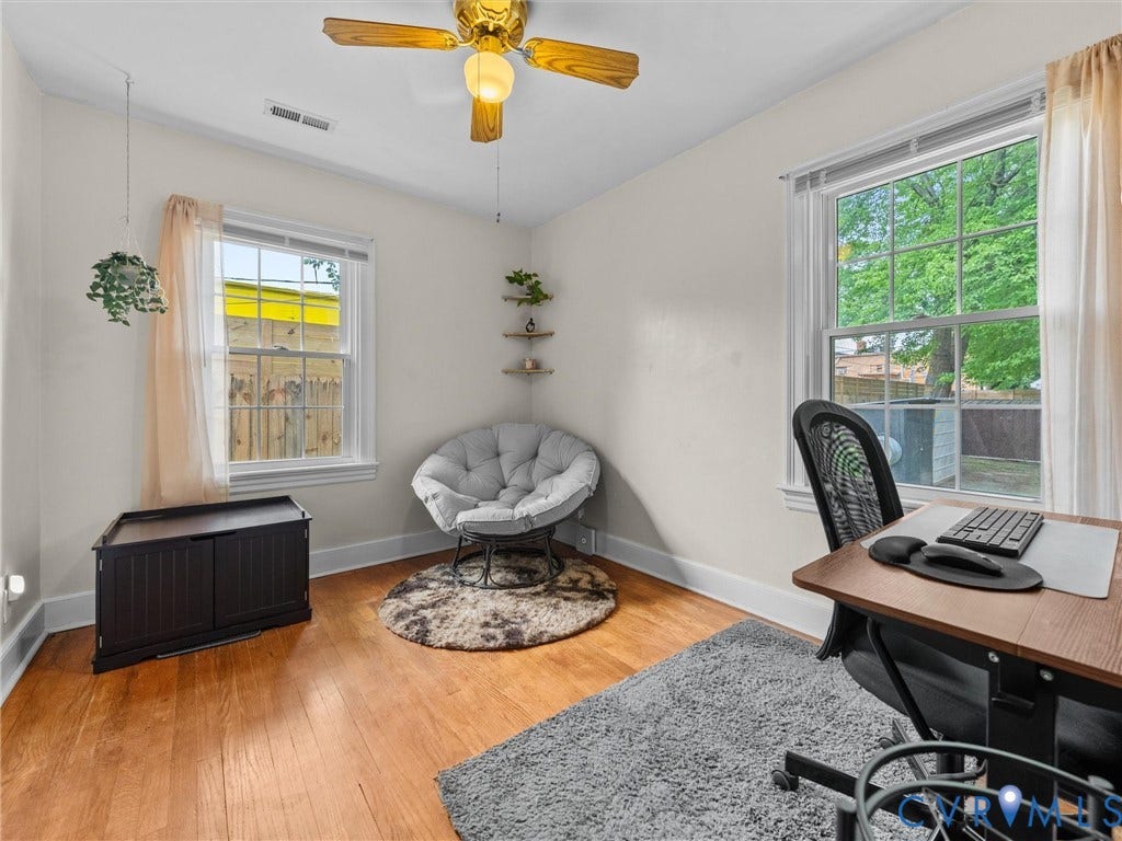 5023 E Seminary Avenue, Richmond, VA 23227 Bright room featuring wood-finish flooring and white baseboards