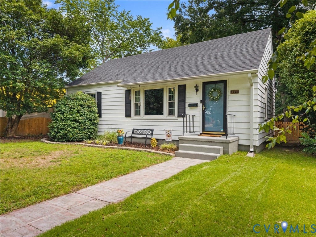 5023 E Seminary Avenue, Richmond, VA 23227 White siding exterior with dark shutters