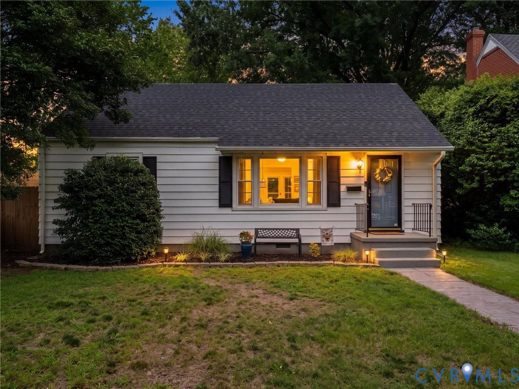 5023 E Seminary Avenue, Richmond, VA 23227 White siding exterior with black shutters and a dark shingle roof