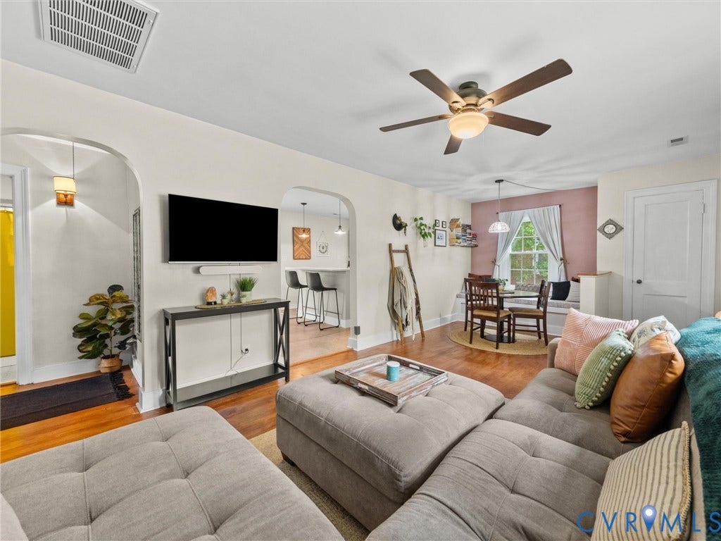5023 E Seminary Avenue, Richmond, VA 23227 Open-concept living space featuring wood-finish flooring, recessed lighting, and a ceiling fan with integrated light fixture