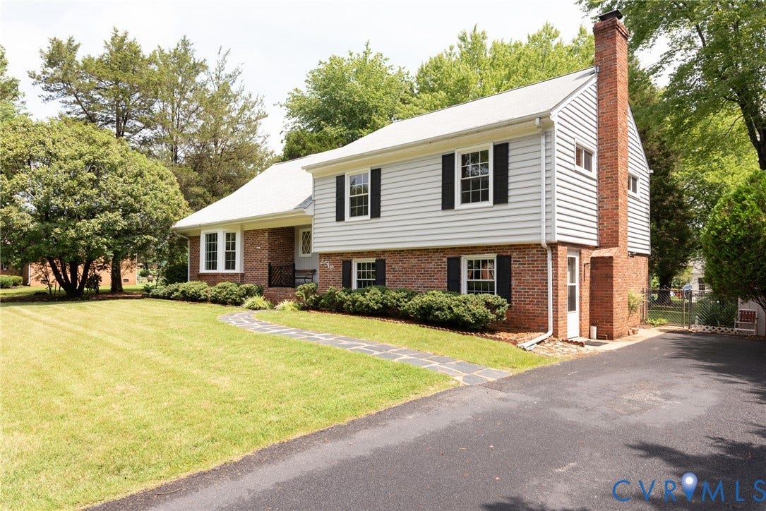 2519 Woodmont Drive, Woodmont, Chesterfield, VA 23235 Split-level residence featuring a brick and siding exterior, bay window, and a prominent brick chimney