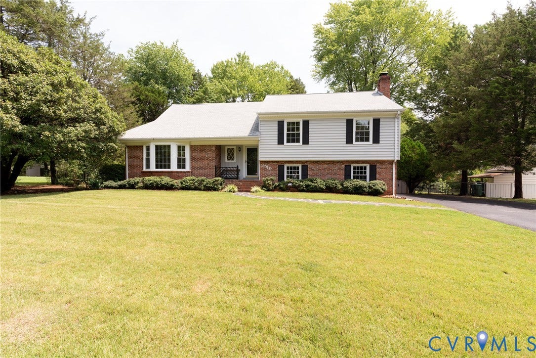 2519 Woodmont Drive, Woodmont, Chesterfield, VA 23235 Split-level residence featuring a brick and siding exterior, a white roof, and a prominent chimney