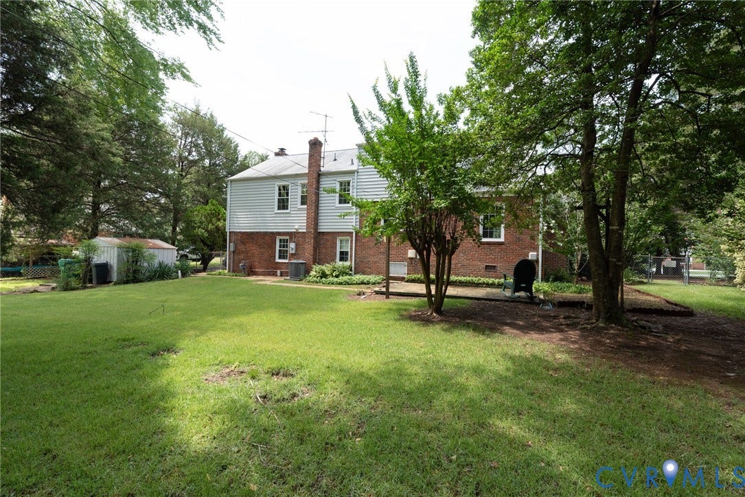 2519 Woodmont Drive, Woodmont, Chesterfield, VA 23235 Expansive lawn area featuring mature trees and a detached shed