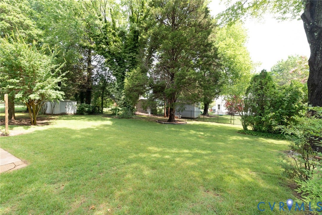 2519 Woodmont Drive, Woodmont, Chesterfield, VA 23235 Expansive green lawn surrounded by mature trees and shrubs