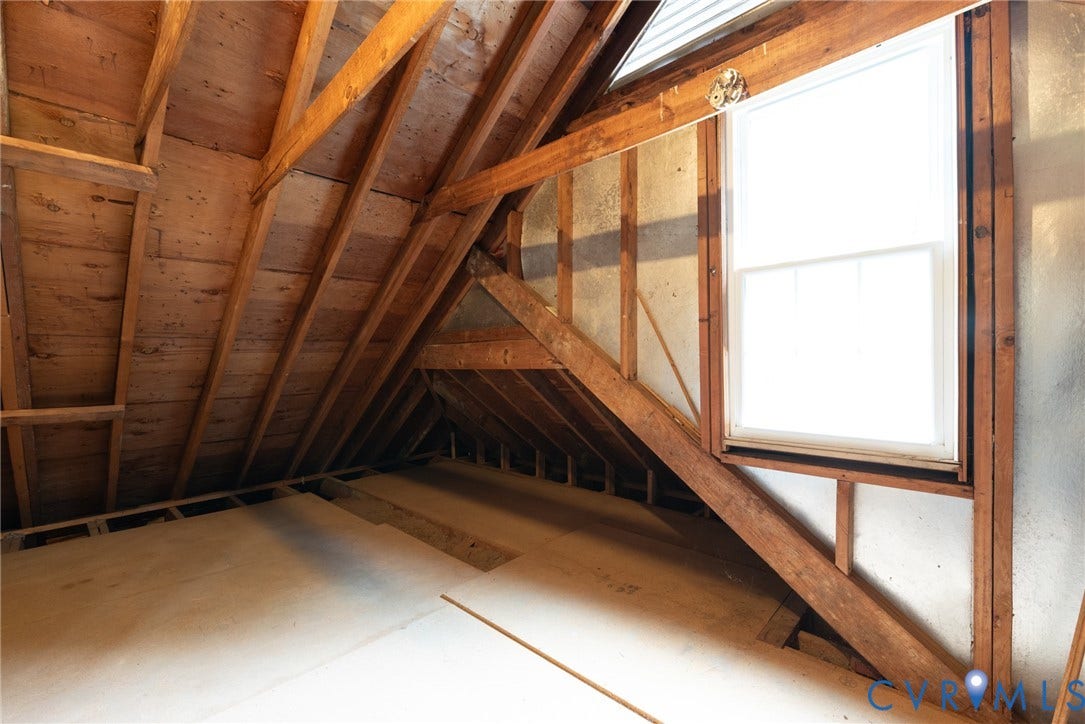 2519 Woodmont Drive, Woodmont, Chesterfield, VA 23235 Attic space featuring exposed wood beams, wood planking, and a white-framed window