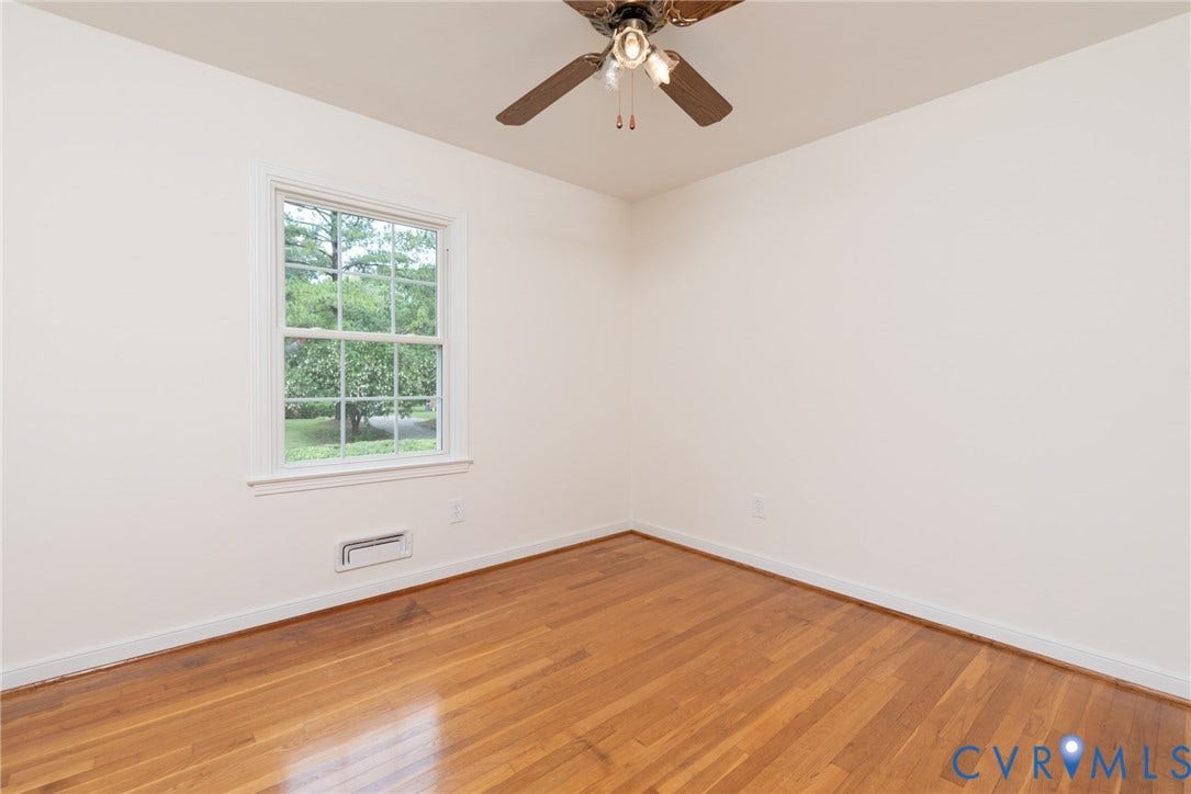 2519 Woodmont Drive, Woodmont, Chesterfield, VA 23235 Hardwood flooring with white baseboards and neutral wall paint