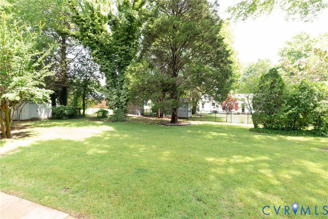 2519 Woodmont Drive, Woodmont, Chesterfield, VA 23235 Expansive green lawn with mature trees and established landscaping
