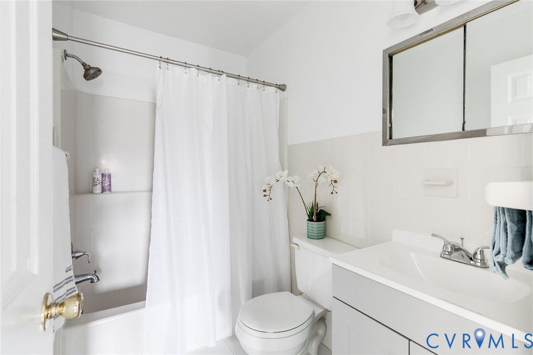 Full bathroom with new vanity and fixtures.