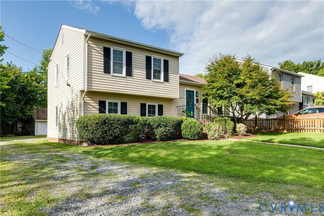 Ample off street parking offered with a gravel driveway to the backyard.