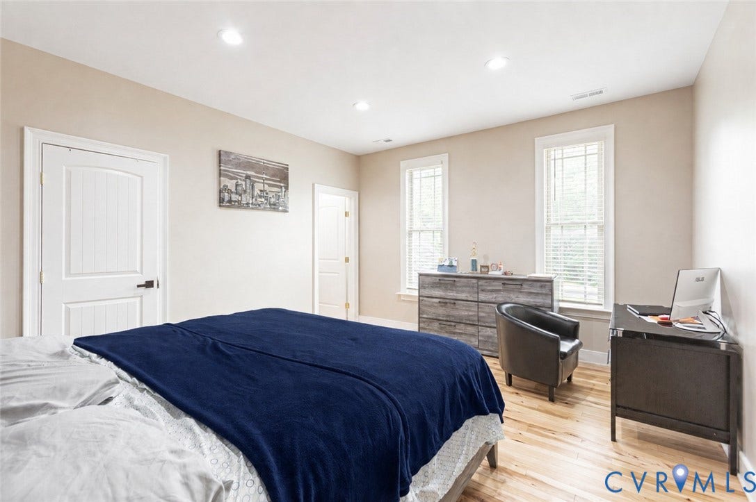 12554 Kain Road, Glen Allen, VA 23059 Recessed lighting, light wood-finish flooring, white paneled doors, and two windows with blinds