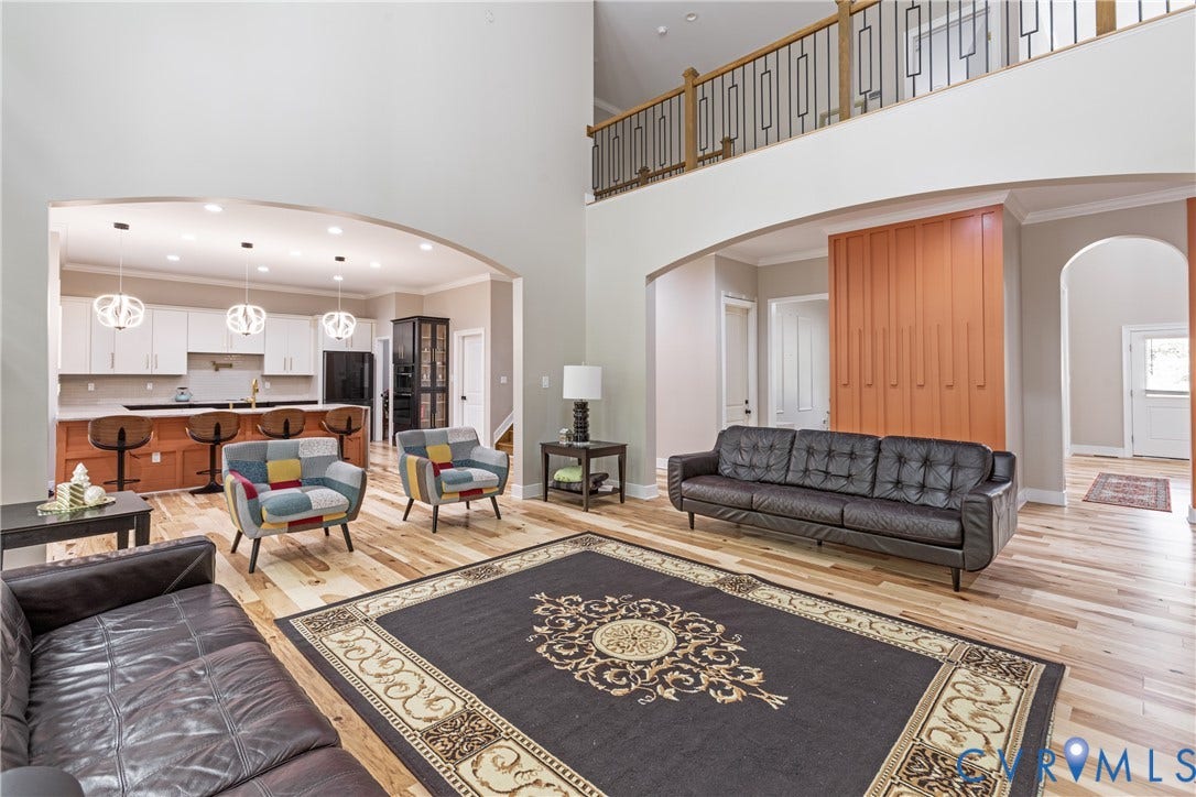 12554 Kain Road, Glen Allen, VA 23059 Dramatic two-story foyer with soaring ceilings and a mezzanine-level railing overlooking the main living spaces