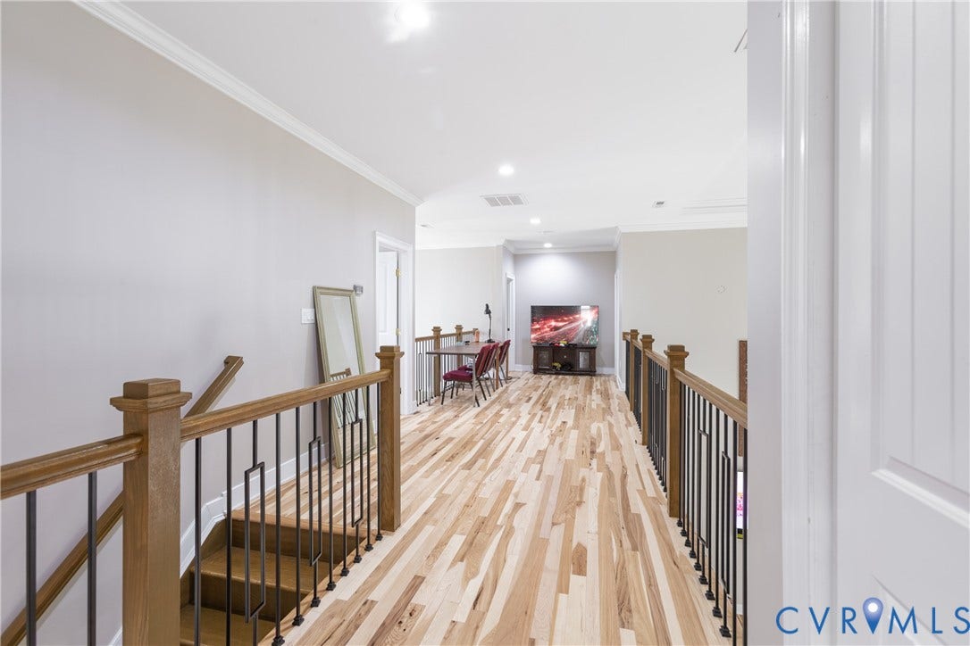12554 Kain Road, Glen Allen, VA 23059 Hardwood flooring, wood newel posts, wrought iron balusters, recessed lighting, and crown molding
