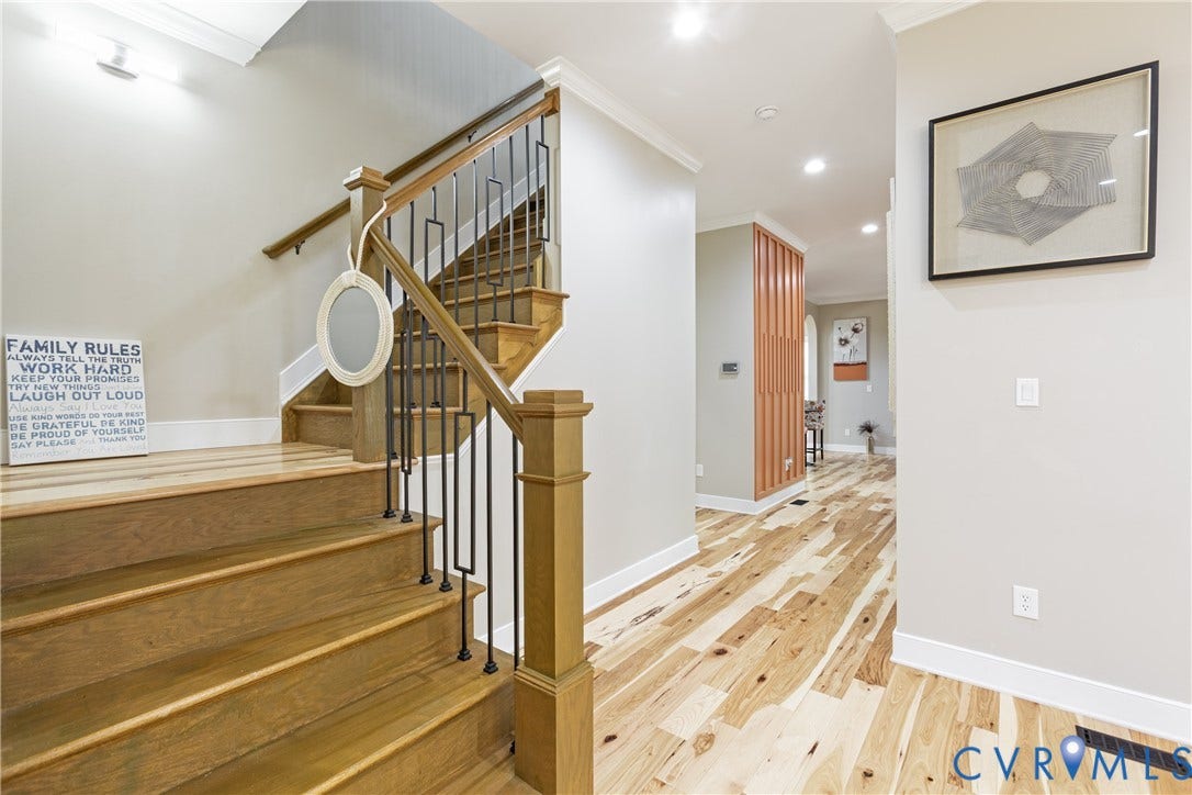 12554 Kain Road, Glen Allen, VA 23059 Hardwood flooring throughout, featuring a staircase with wood treads and a wrought iron railing