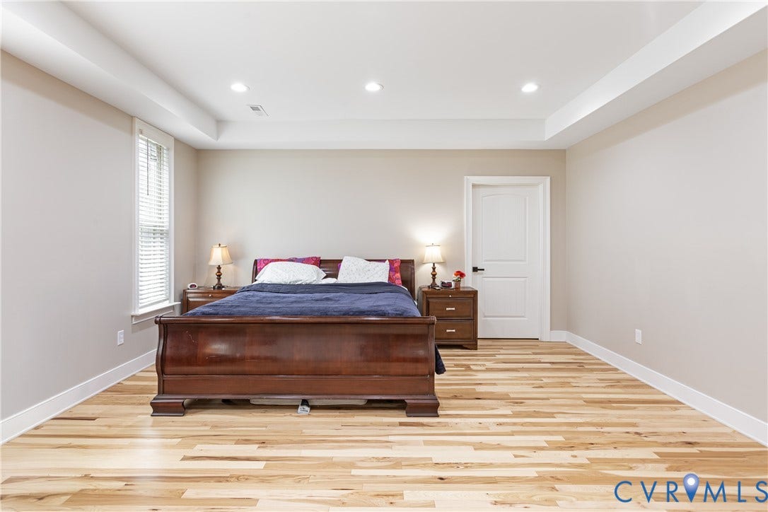 12554 Kain Road, Glen Allen, VA 23059 Recessed lighting, tray ceiling, light wood flooring, single window with blinds, and a two-panel interior door