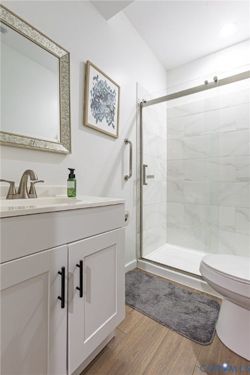 12554 Kain Road, Glen Allen, VA 23059 Contemporary bathroom featuring a white shaker-style vanity with dual drawers and matte black hardware, white quartz countertop, brushed nickel faucet, and large framed mirror
