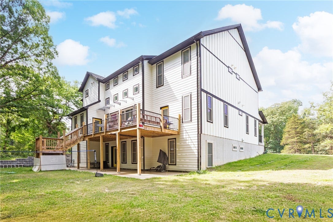 12554 Kain Road, Glen Allen, VA 23059 Multi-level exterior with white vertical siding and black trim accents