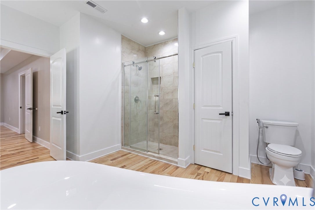 12554 Kain Road, Glen Allen, VA 23059 Walk-in shower with clear glass enclosure, tile surround, and built-in niche
