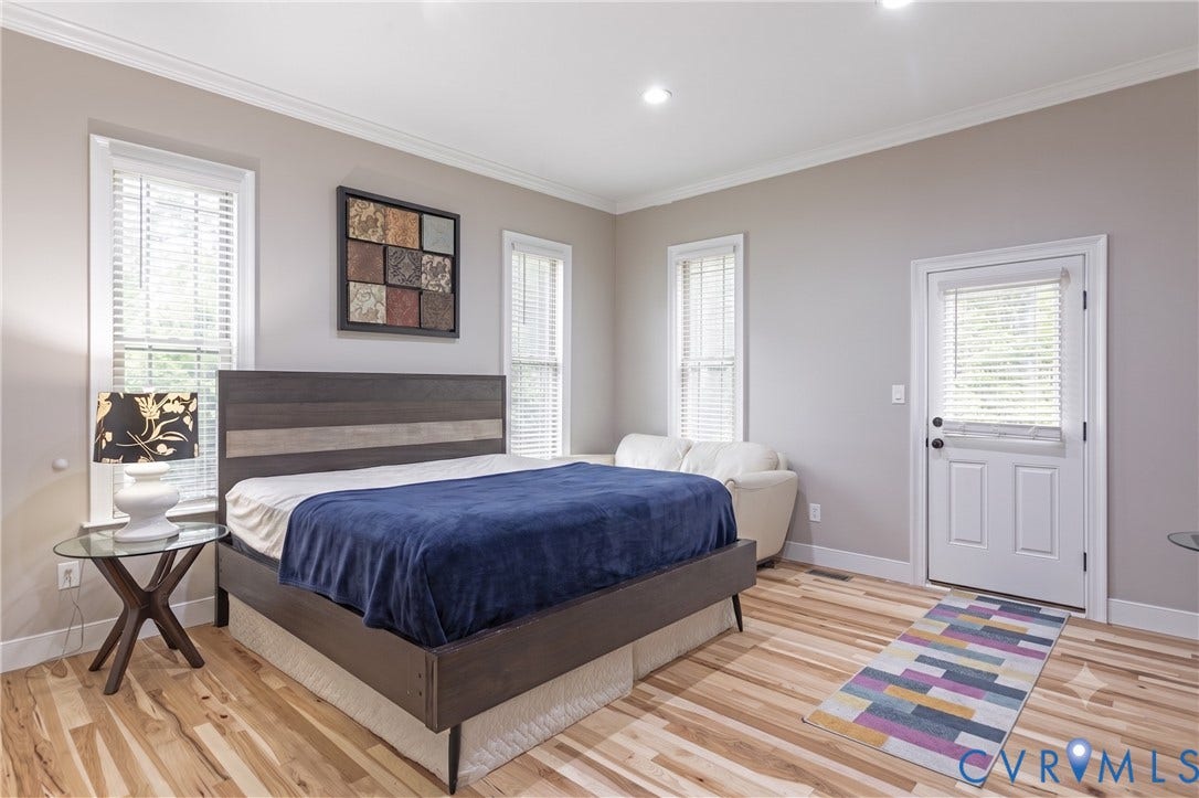 12554 Kain Road, Glen Allen, VA 23059 Hardwood flooring, recessed lighting, white crown molding, multiple windows with blinds, and an exterior door