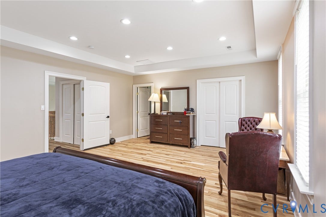 12554 Kain Road, Glen Allen, VA 23059 Recessed lighting, wood-finish flooring, tray ceiling, multiple windows with blinds, and white interior doors