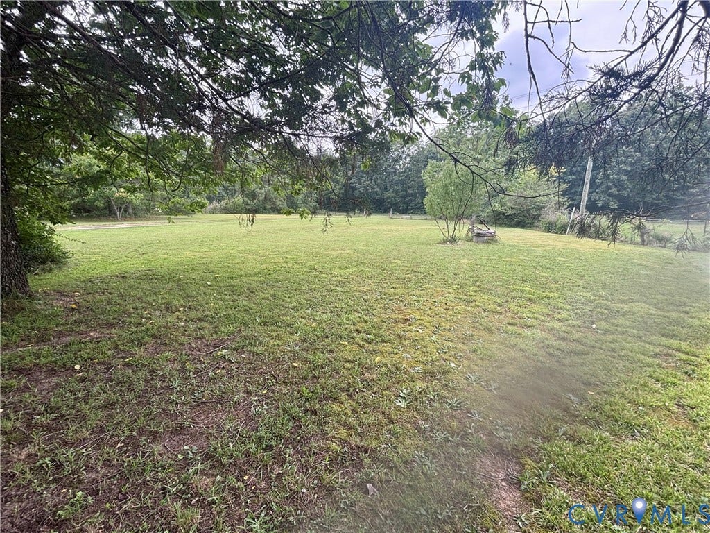 727 Frenchs Store Road, French's Store, Cumberland, VA 23040 Expansive grassy area with mature trees framing the foreground