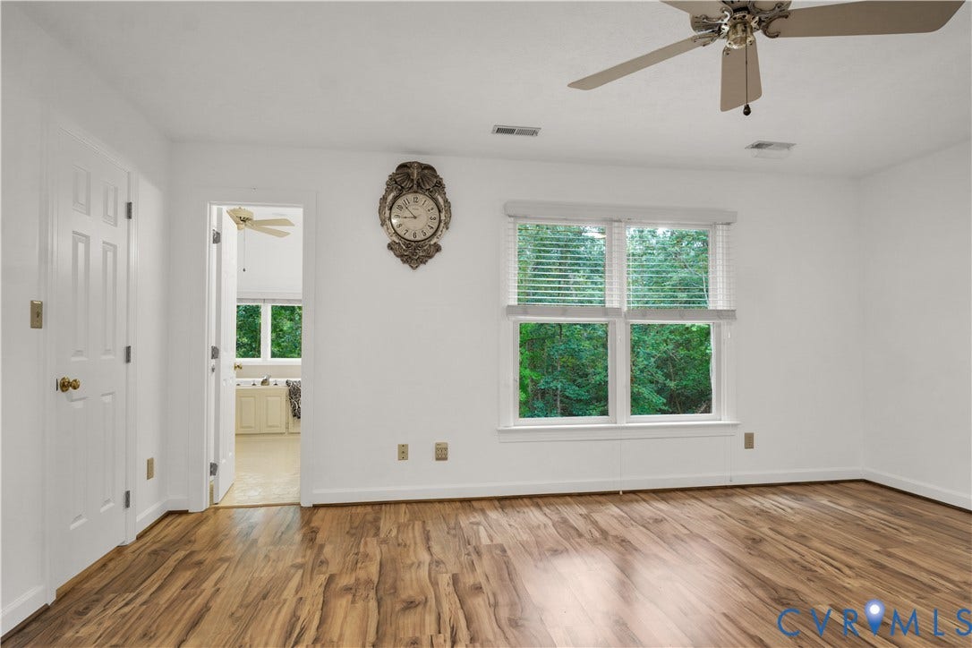 3005 Heritage Landing Road, Heritage Landing, Williamsburg, VA 23185 Spacious Primary Bedroom with Wooded View, Walk-in Closet, and Large Bathroom