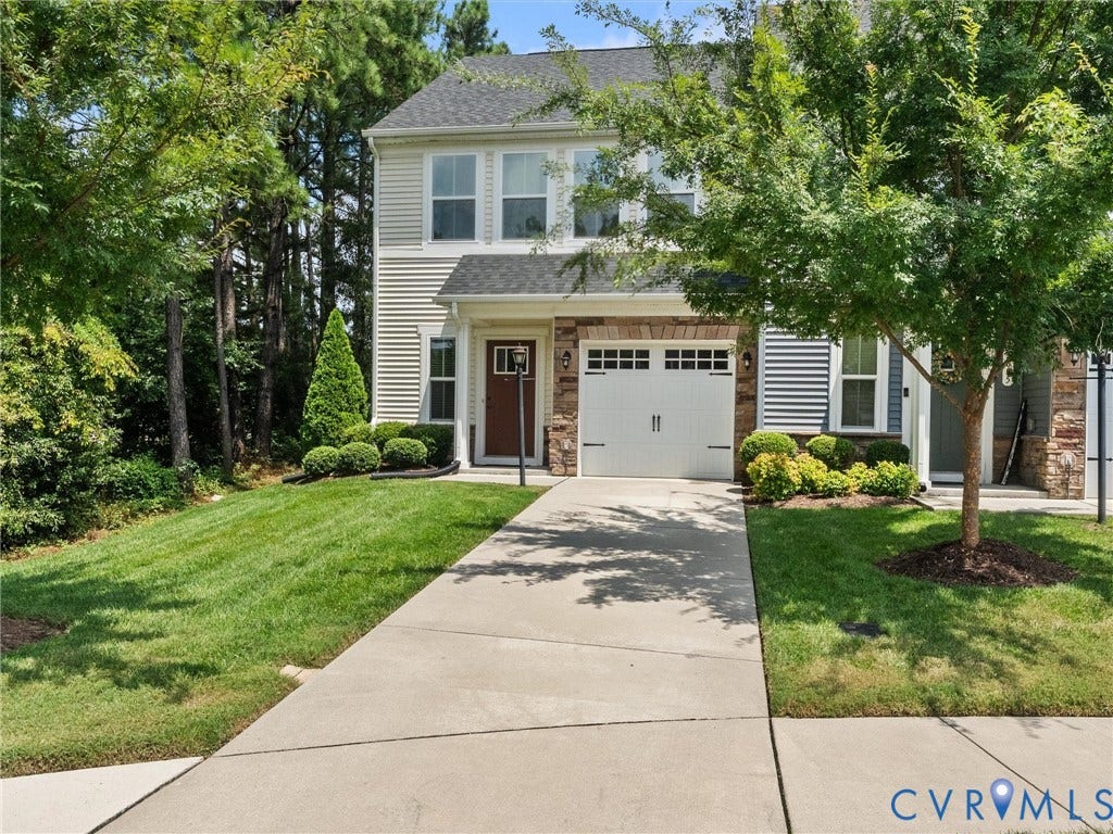 12601 Prestonfield Drive, Blalock, Chesterfield, VA 23836 Two-story residence featuring light-colored siding, a white garage door, and a brown front door