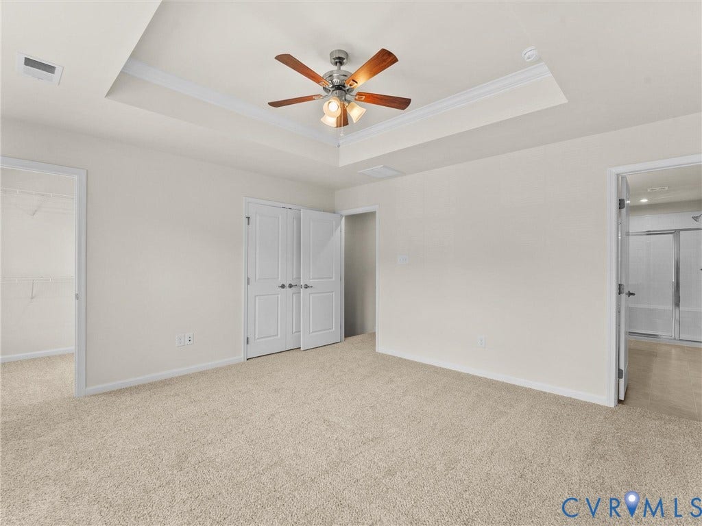 12601 Prestonfield Drive, Blalock, Chesterfield, VA 23836 Tray ceiling with crown molding, ceiling fan, neutral wall paint, and plush carpet flooring