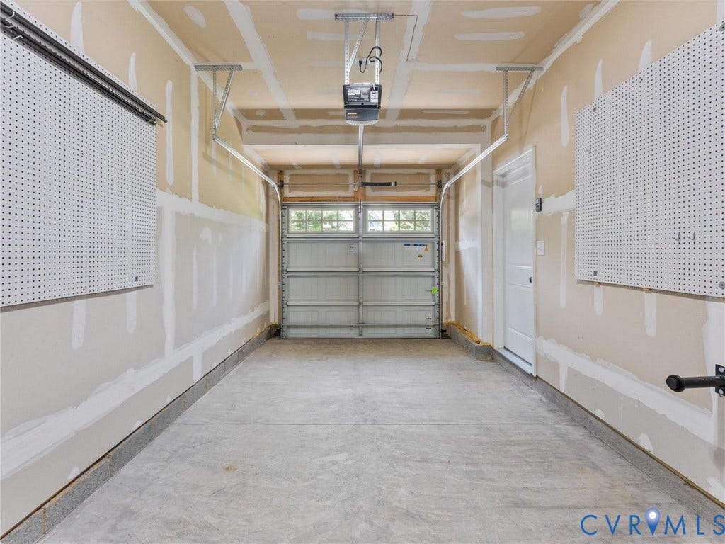 12601 Prestonfield Drive, Blalock, Chesterfield, VA 23836 Attached garage featuring a concrete floor, automatic garage door opener, and a side access door