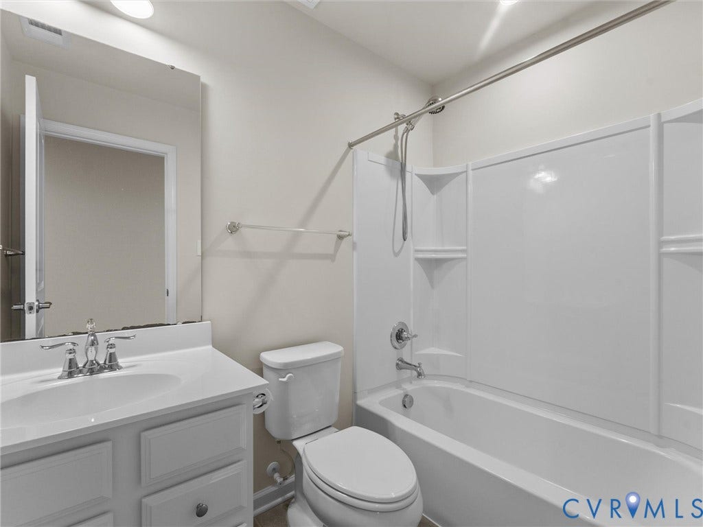 12601 Prestonfield Drive, Blalock, Chesterfield, VA 23836 White vanity with a single basin sink, chrome faucet, and storage cabinetry