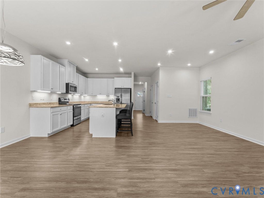 12601 Prestonfield Drive, Blalock, Chesterfield, VA 23836 Open-concept living space with wood-finish flooring, recessed lighting, and a modern kitchen