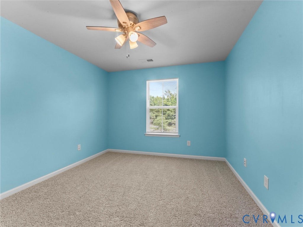 12601 Prestonfield Drive, Blalock, Chesterfield, VA 23836 Expansive room with neutral carpet, a single window, and a ceiling fan with integrated lighting